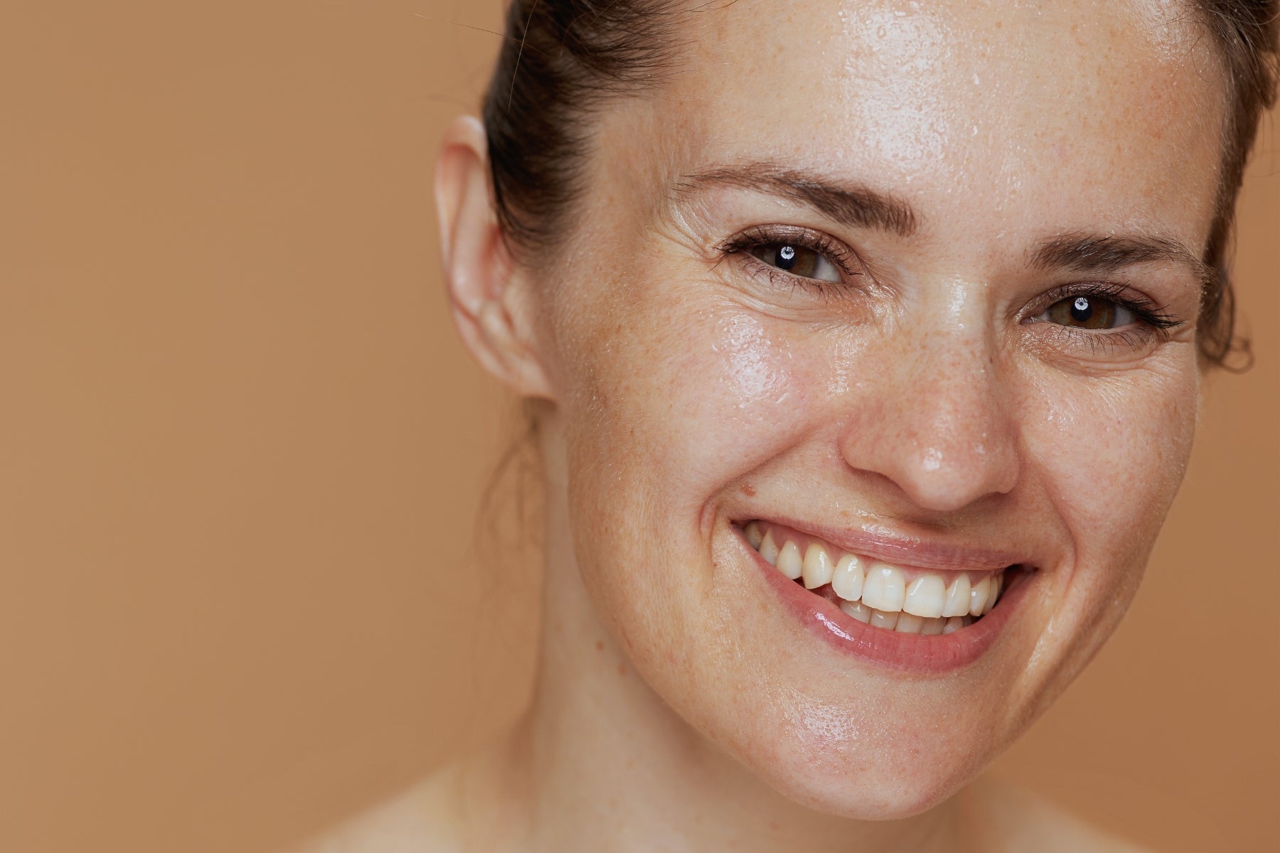 woman smiling with hydrated skin