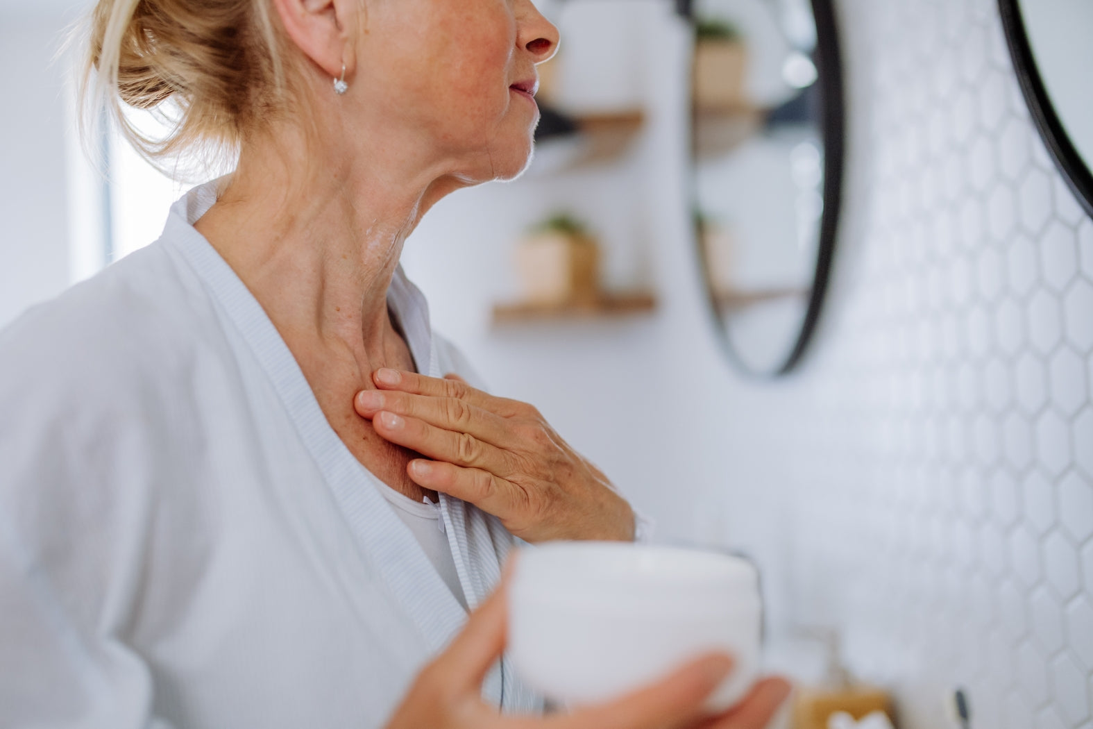 Woman applying skincare to skin