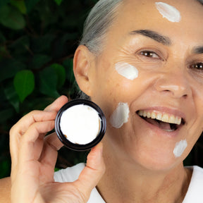 Woman applying ManukaRx Nourishing Night Cream to her face