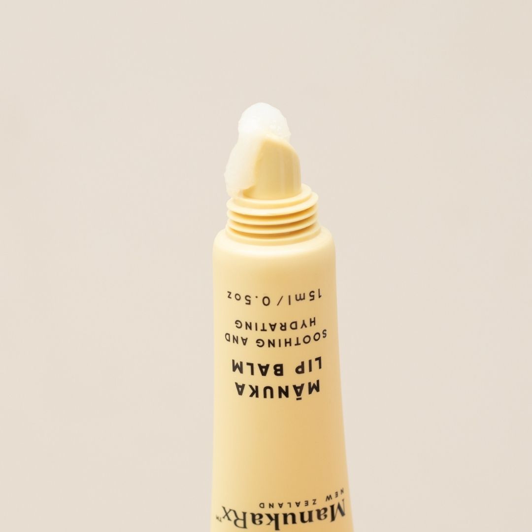 Close up image of ManukaRx Mānuka Lip Balm with product coming out of applicator 